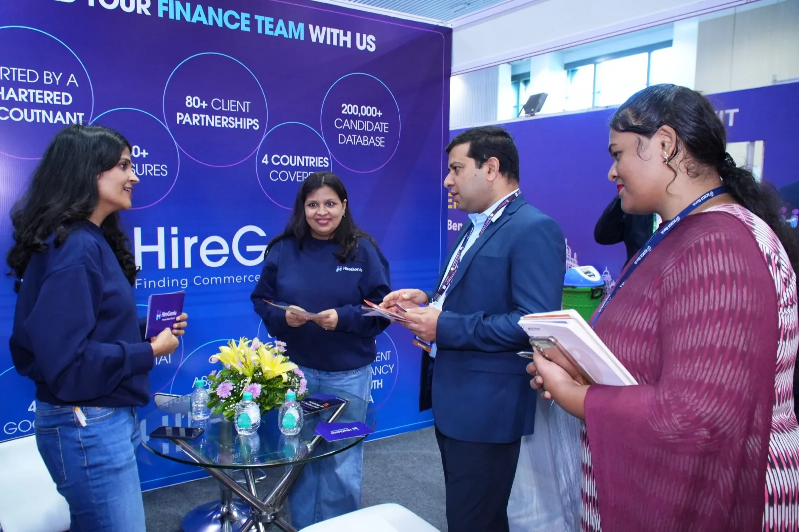 HireGenie consultants in conversation with visitors at their exhibition stand