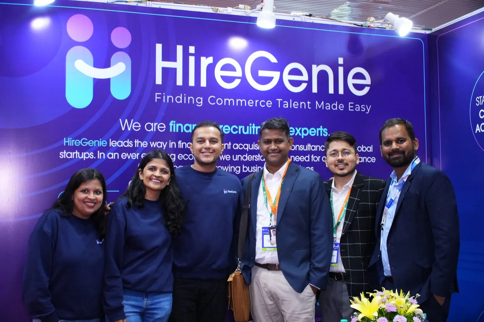 The full HireGenie team together at their exhibition stand