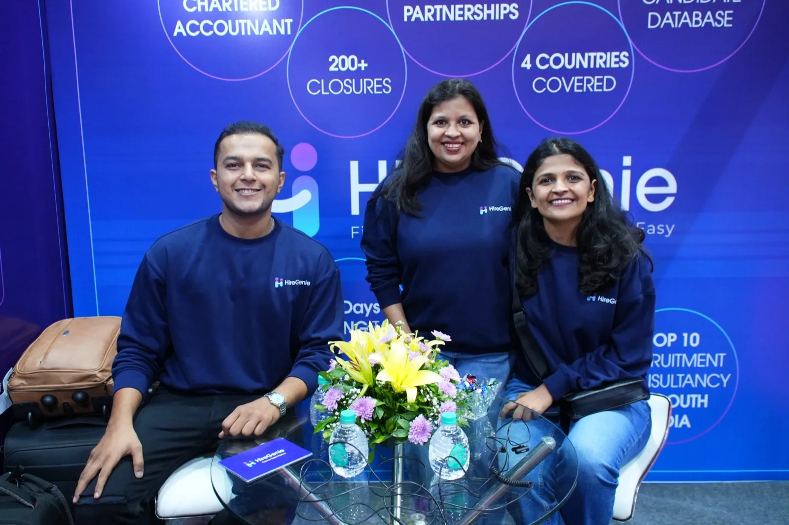 The HireGenie finance recruitment team seated at their stand