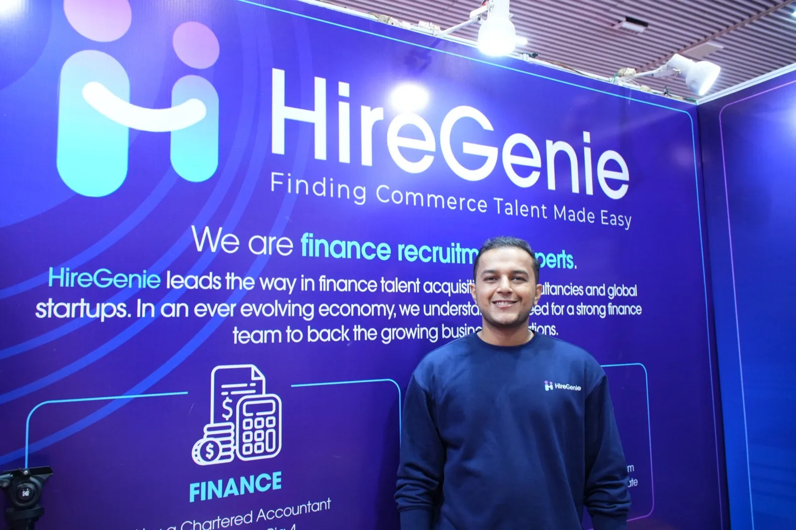 The HireGenie brand wall at a recruitment exhibition